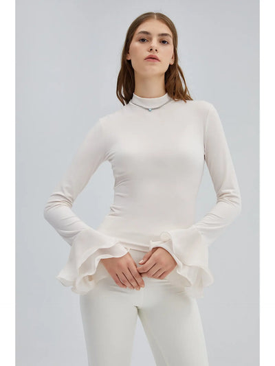 Pull fin avec poignets à volants transparents